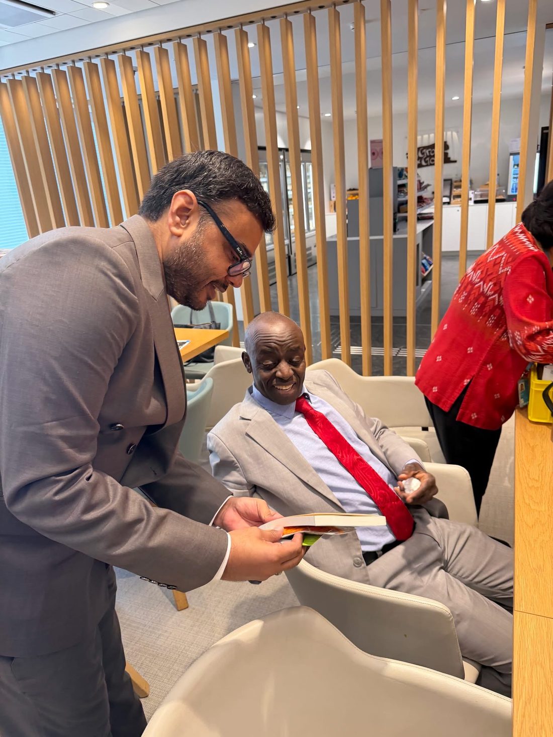 Anand Priya Deo showing Follow Your Heart to a guest at the Geneva launch